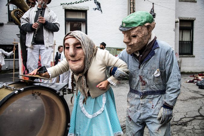 Two performers in puppet masks from the Bread and Puppet Theater, Glover, Vermont