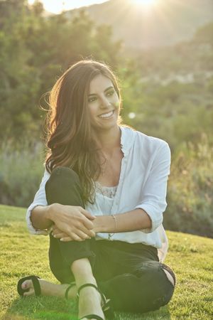 Content woman sitting on lawn