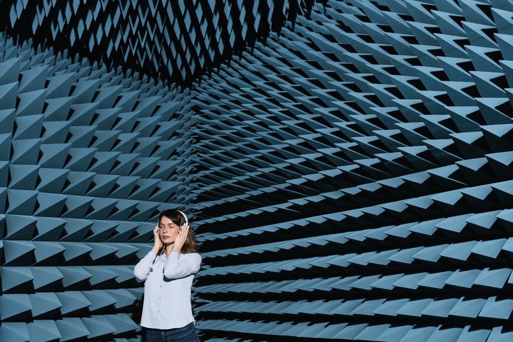 Woman in sound room listening to music