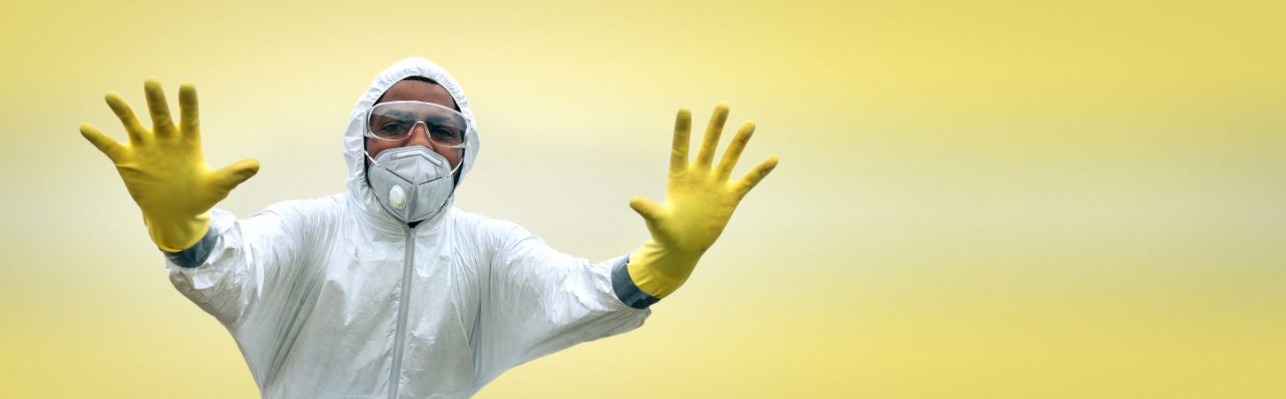 Man in protection suit prohibiting entry