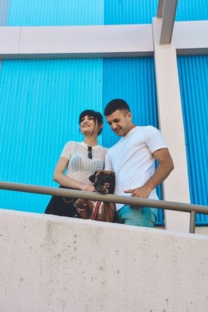 Couple with their Boxer dog.