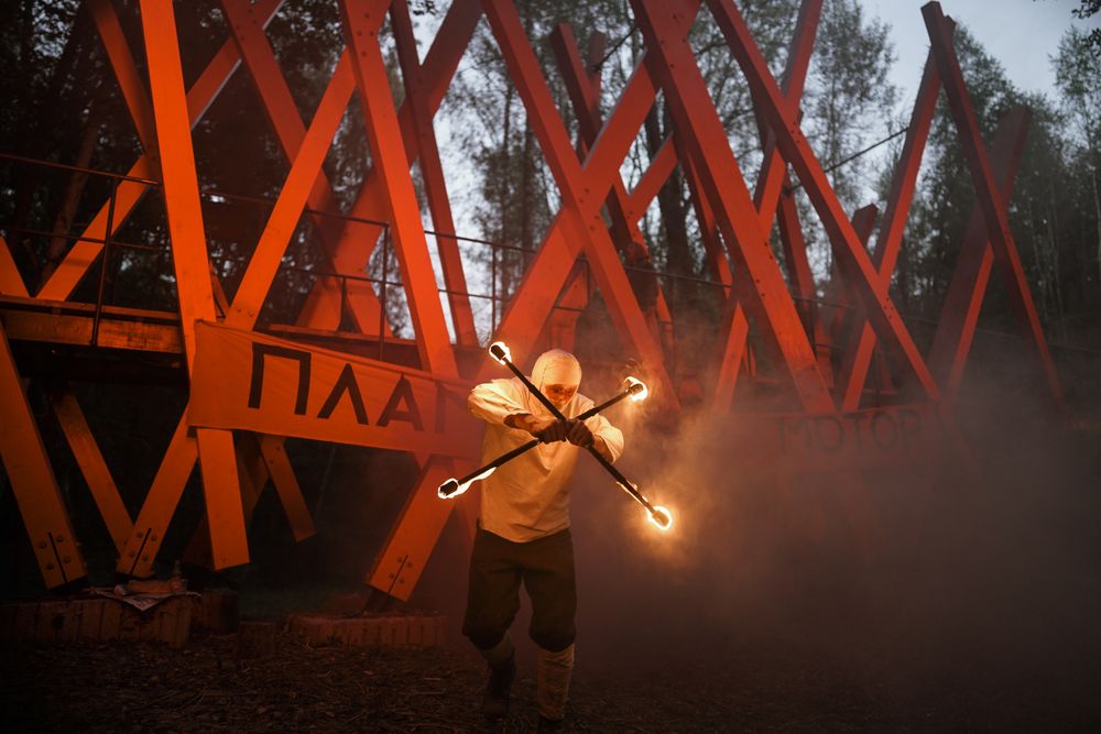 Man doing a show with fire sticks