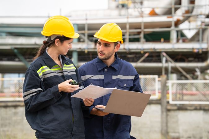 Engineer worker checking project at petrochemical factory or refinery oil plant industrial.