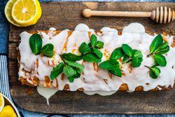 Top of frosted fresh lemon cake on cutting board