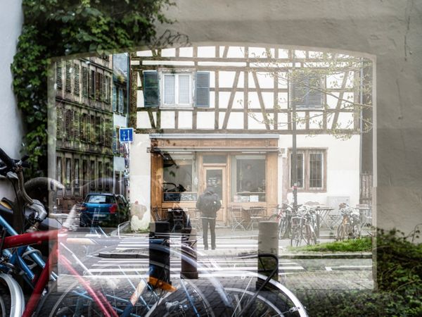 Multiple exposure. Unusual view of the city. Bicycles and old city of Strasbourg.