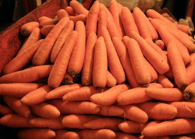 Close up of stacked carrots in street market