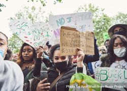London, England, United Kingdom - June 6th, 2020: Group of mostly female protesters with BLM signs 0JGdN5