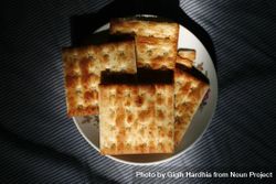 Top view of crackers on plate in morning light 42Aey5