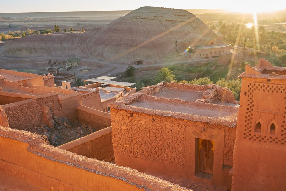 Ancient city near river in desert and wonderful sky