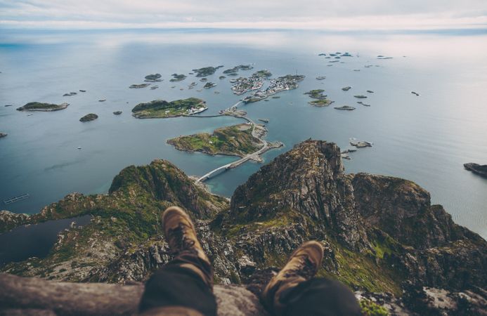 Person looking down islands in ocean