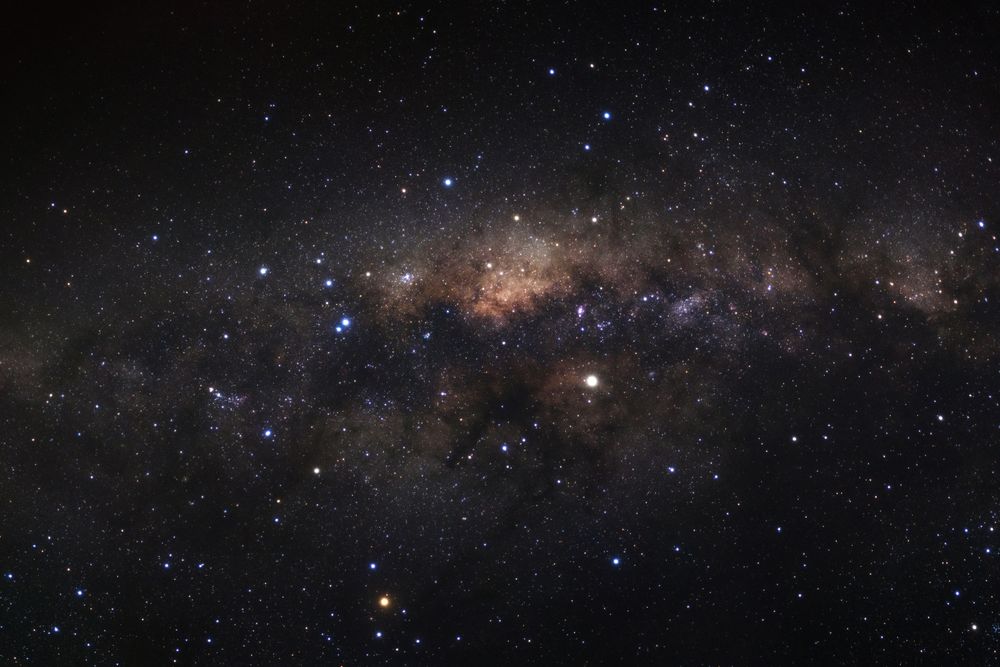 Milky way galaxy with stars and space dust in the universe, Long exposure photograph, with grain.