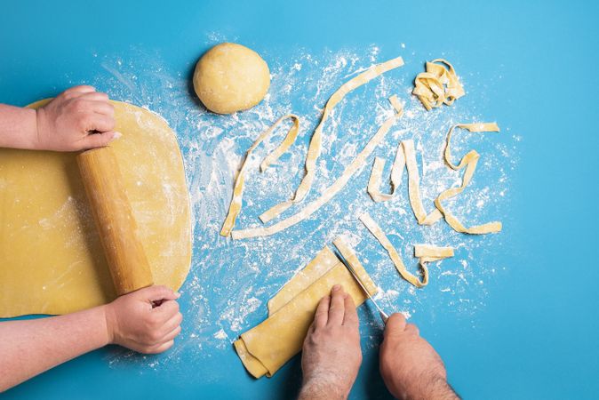 Couple making pasta by hand