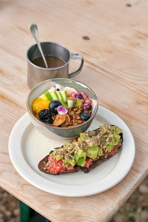 Healthy breakfast with muesli bowl and avocado toast