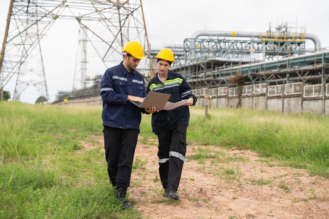 Engineer worker checking project at petrochemical factory or refinery oil plant industrial.