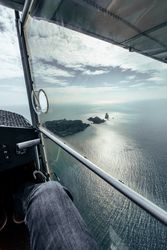 Flight over islands in the middle of the sea
