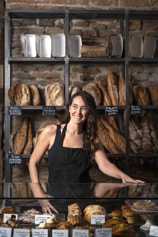 Young female selling baguettes