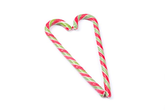 Sweet candy canes isolated on plain background