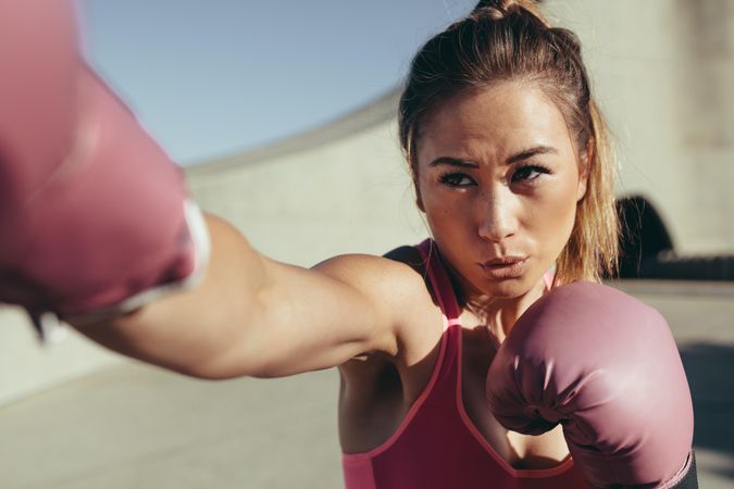 Female boxer practicing boxing