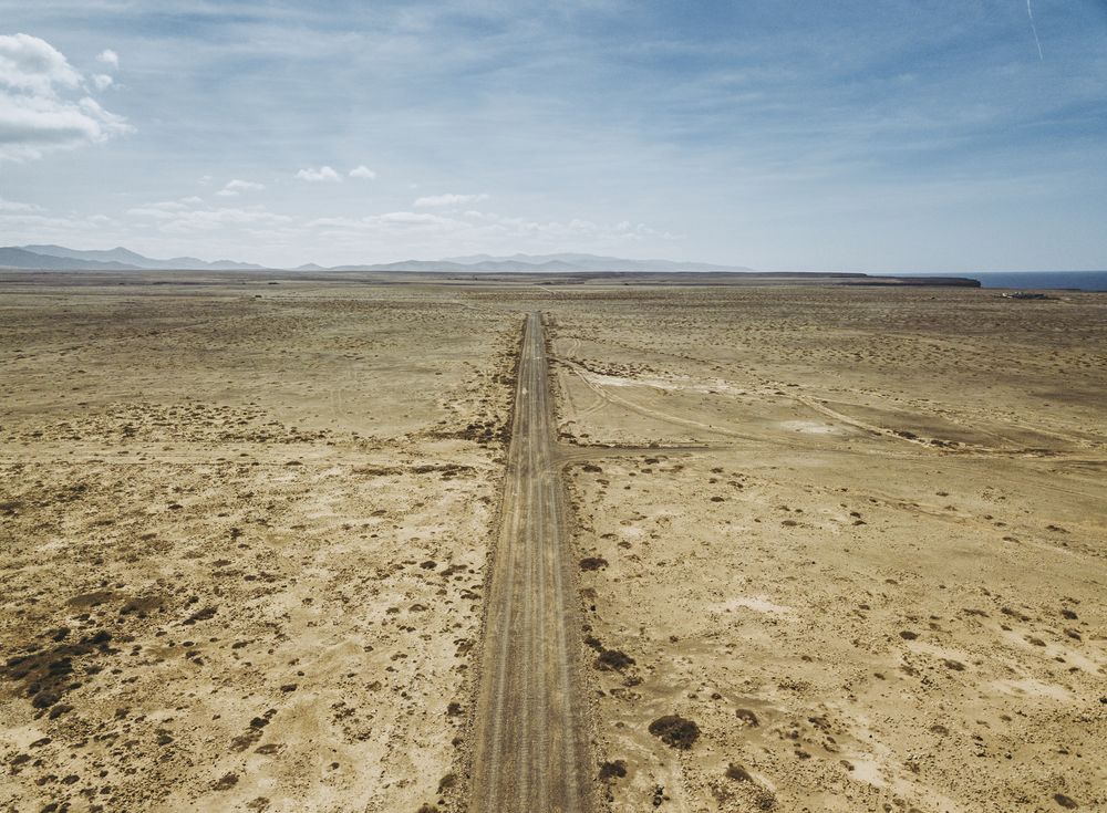 Car driving on road in picturesque desert