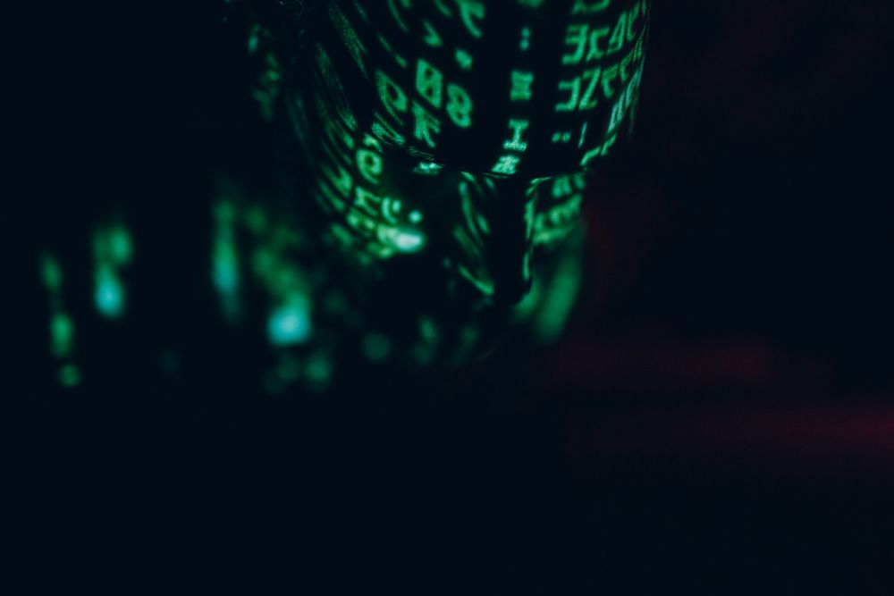 Green digital text on a person