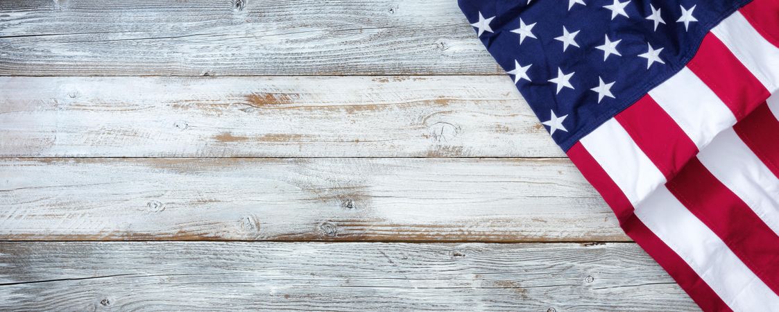 Independence Day concept with USA Flag on light wooden background