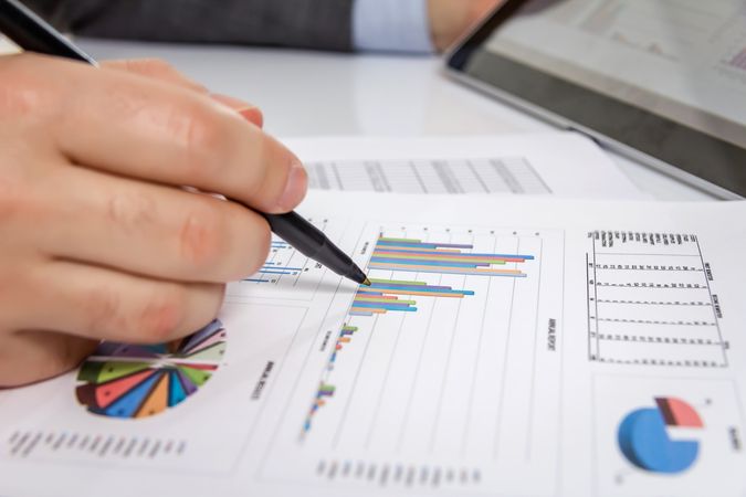 Businessman reviewing documents in digital tablet