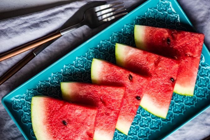 Looking down at watermelon sliced on plate
