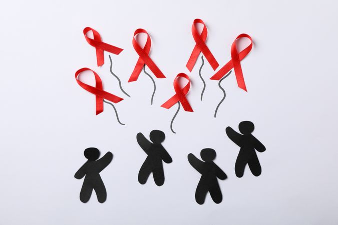 Awareness ribbons and people appliques on blank background, space for text
