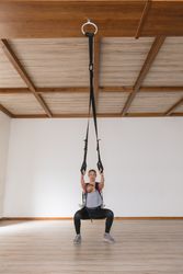 Mother exercising with baby in gym