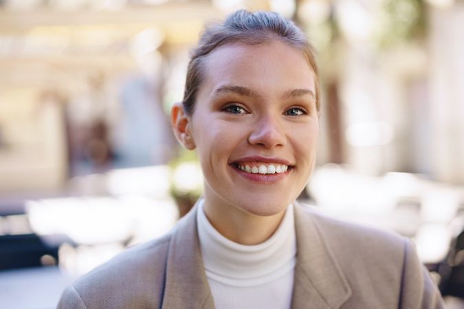 A Smiling Young Woman in a Stylish and Chic Setting That Exudes Confidence and Charm
