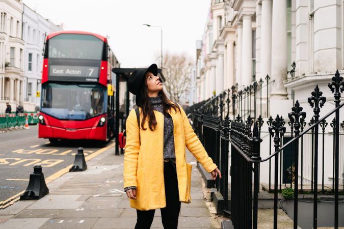 Female tourist looking at buildings on street