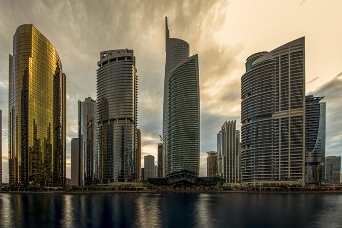 Skyscrapers of UAE across seashore during daytime