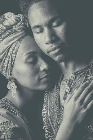 Woman pulling hand to face of man
