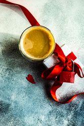 Top view of drink with gift with red padlock