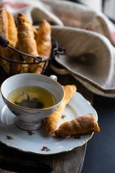 Cup of tea with pastry