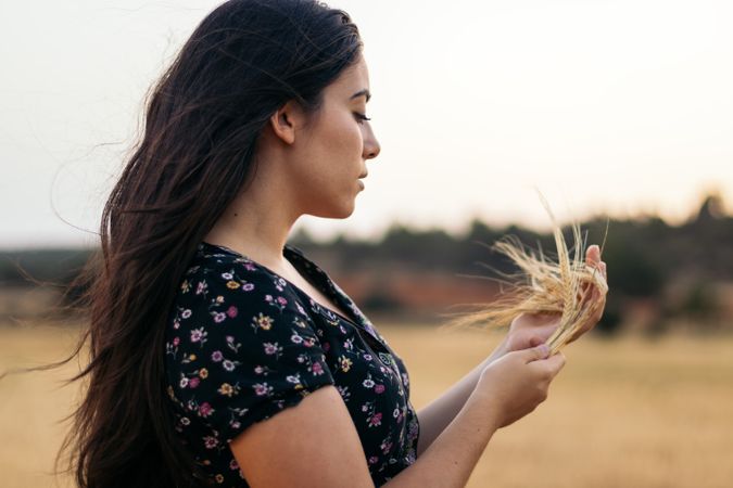 Portrait of a young woman with long hair in the countrysid