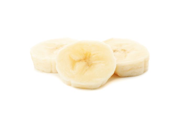 Banana slices isolated on neutral background. Fresh fruit