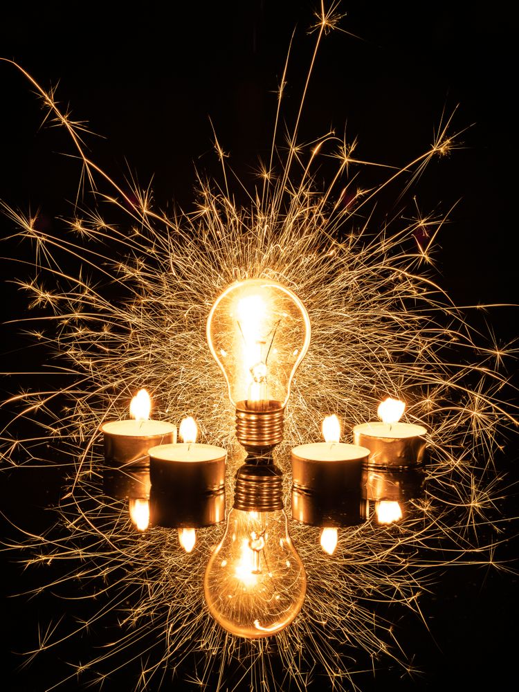 Sparkling light bulb and candles