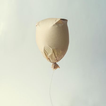 Paper bag balloon on light background