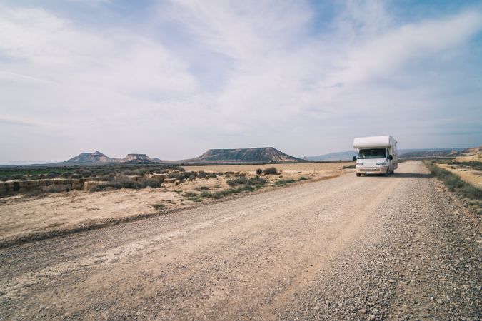 trailer on empty road along desert