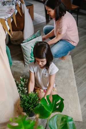Mother and daughter preparing tent to camping at home