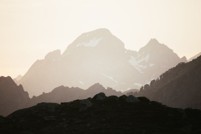 Majestic mountains range in clouds