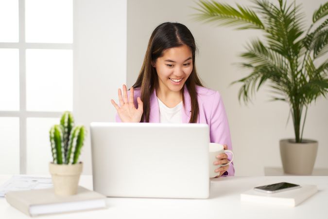 young Asian woman holding a video conference