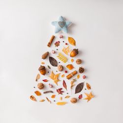 Christmas tree made of various autumn leaves and fruits