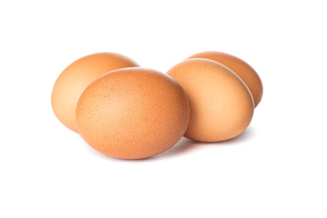 Brown chicken eggs isolated on plain background