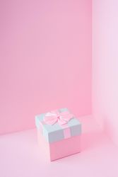 Pink and baby blue jewelry gift box on pastel backdrop