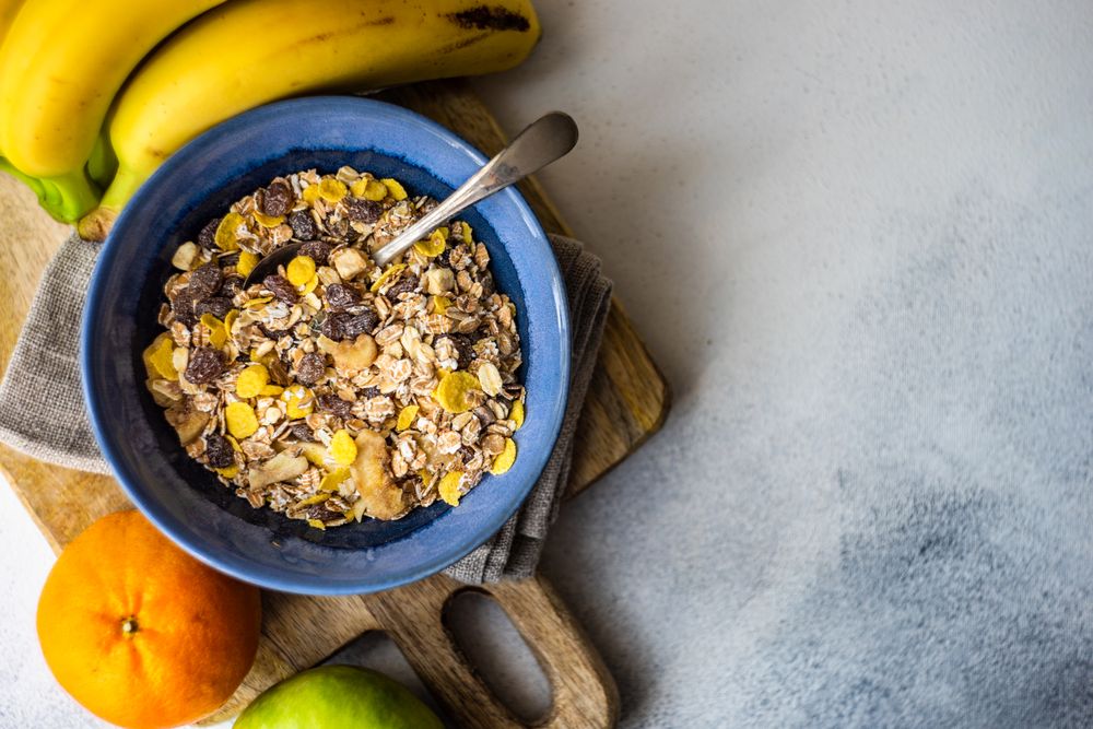 Top view of hearty bowl of oatmeal with dried fruit