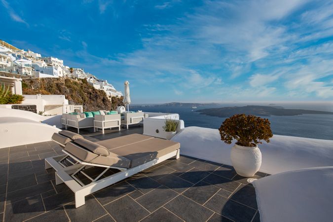Reclining chairs overlooking the Aegean Sea in Santorini