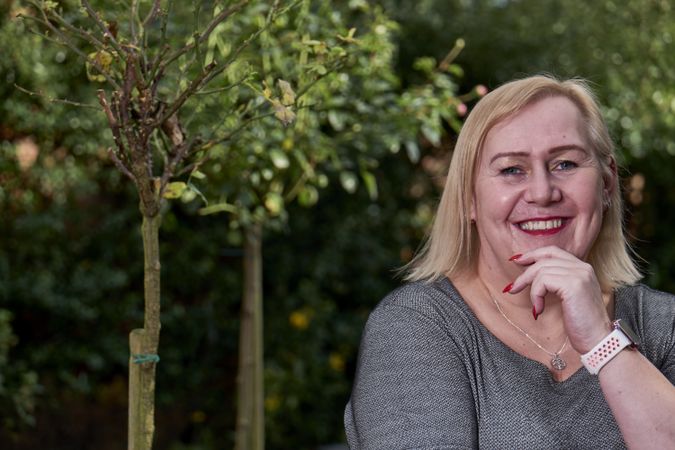 Portrait of woman in garden with copy space