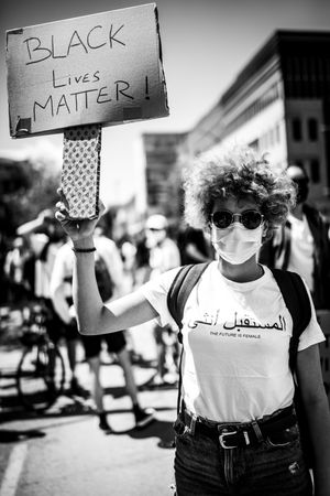 MONTREAL, QUEBEC, CANADA – June 7 2020- protester holding a BLM sign during a protest